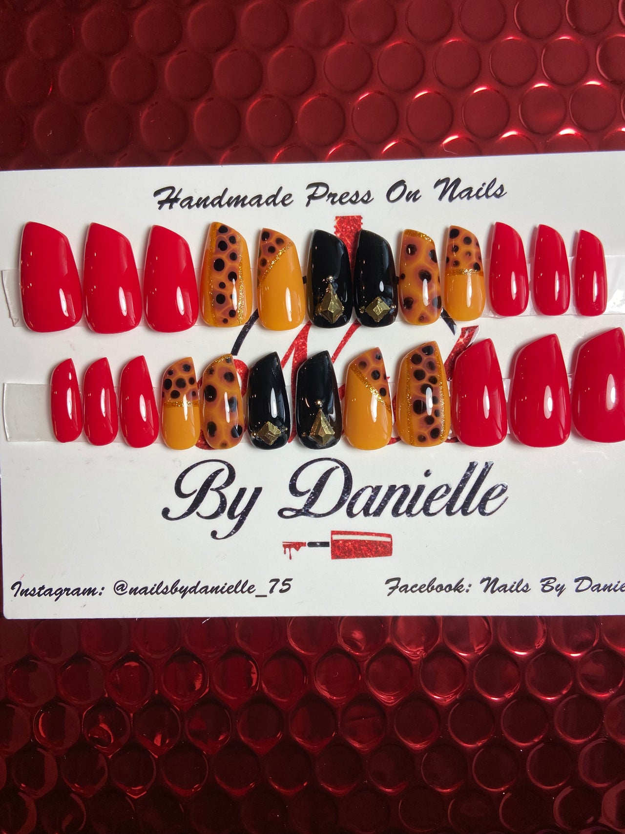 Red Lipstick Nails with Black and Animal Print Accents